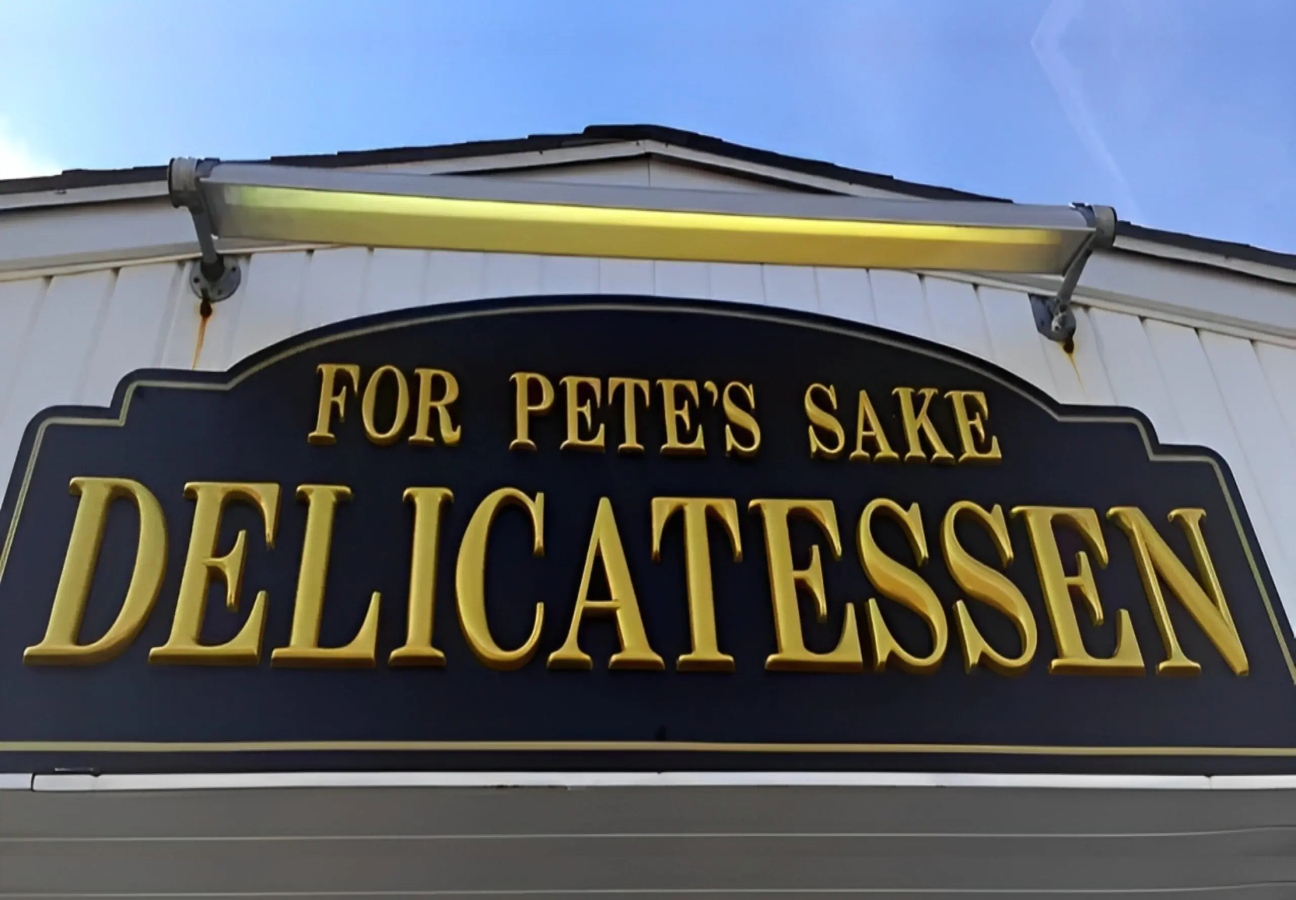 For Pete's Sake Delicatessen signboard.