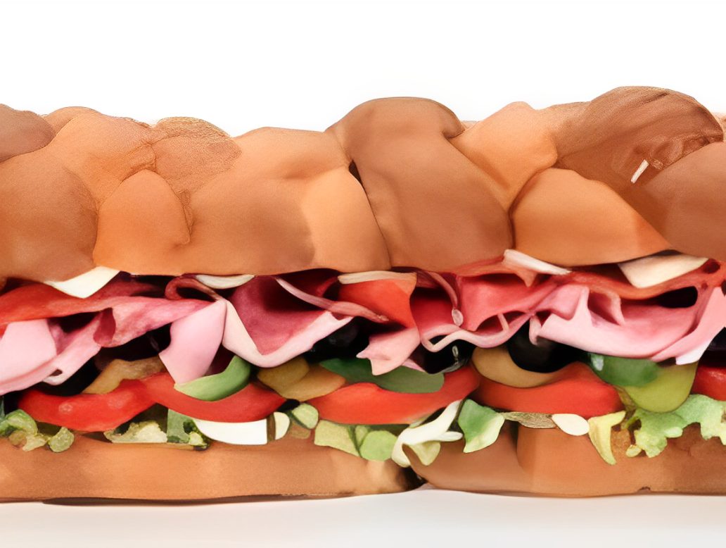 Sub sandwich with various meats and vegetables.